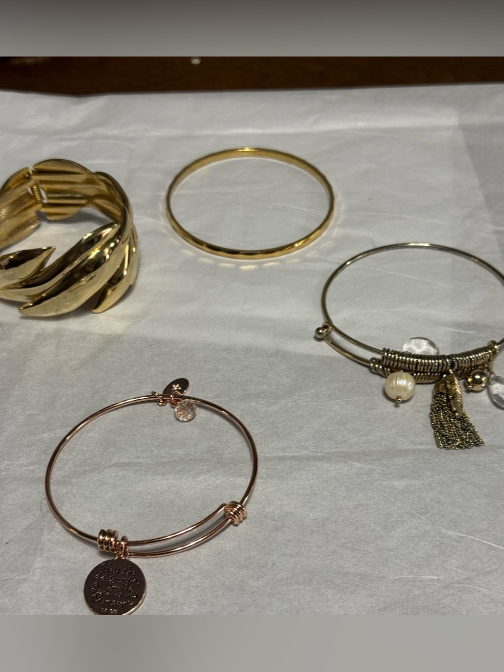 Lot of 4 Gold Tone bangle bracelets